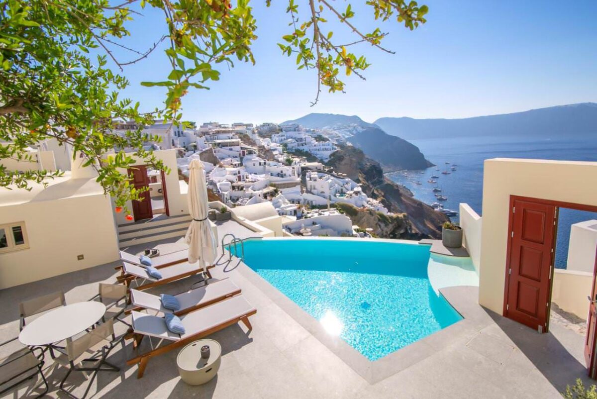 Outdoor swimming pool and view over Caldera at Aloia Villas