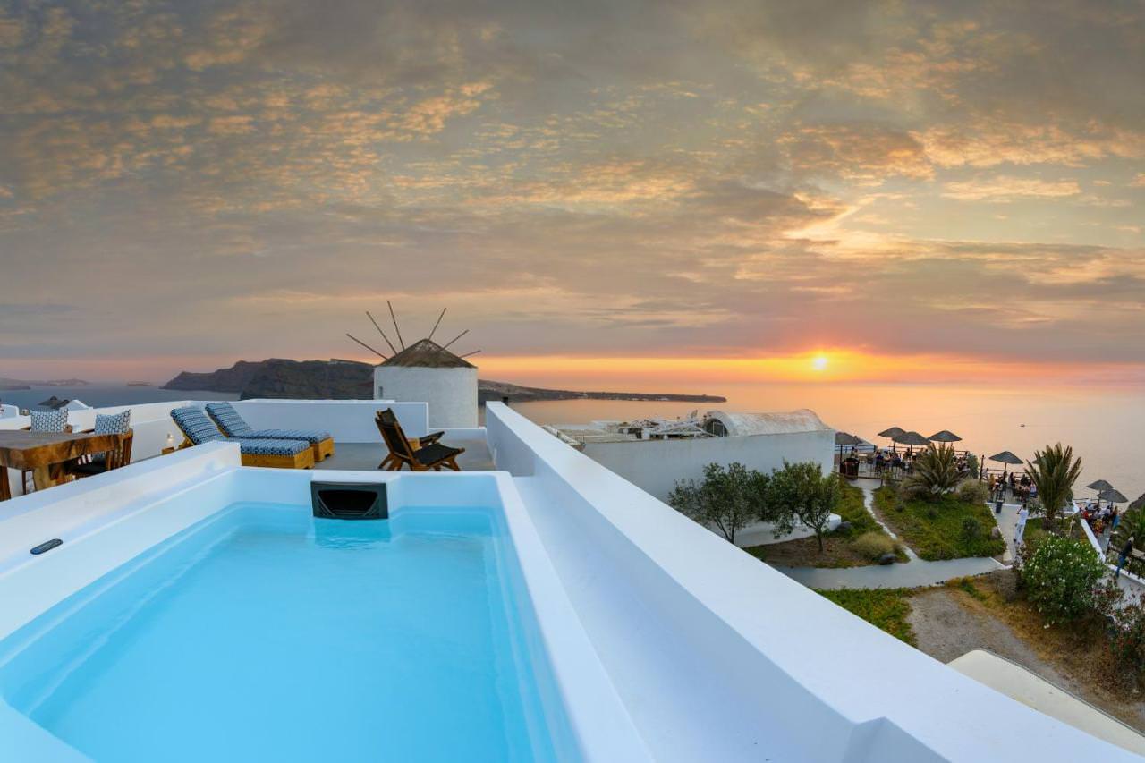 Sunset views from rooftop with swimming pool at Cape Suite Oia